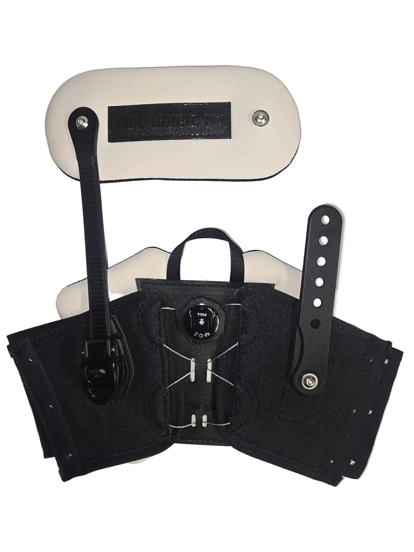 Black adjustable wrist support brace with a central buckle closure, shown laid flat on a white background with a matching white padded pad and black straps.